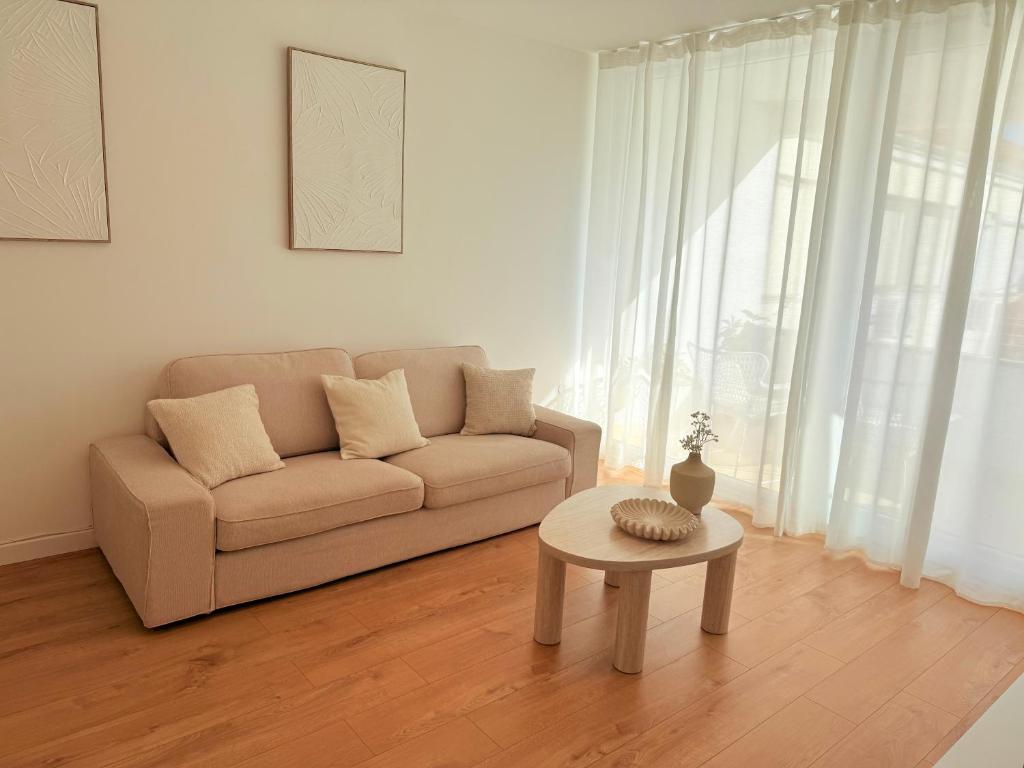 a living room with a couch and a table at Kalelarga Residence in Zadar