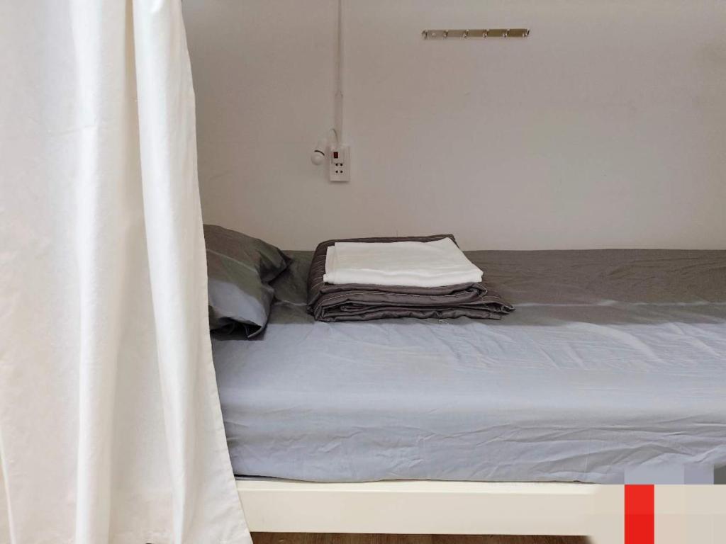 Postel nebo postele na pokoji v ubytování Bandlive Backpacker Hostel