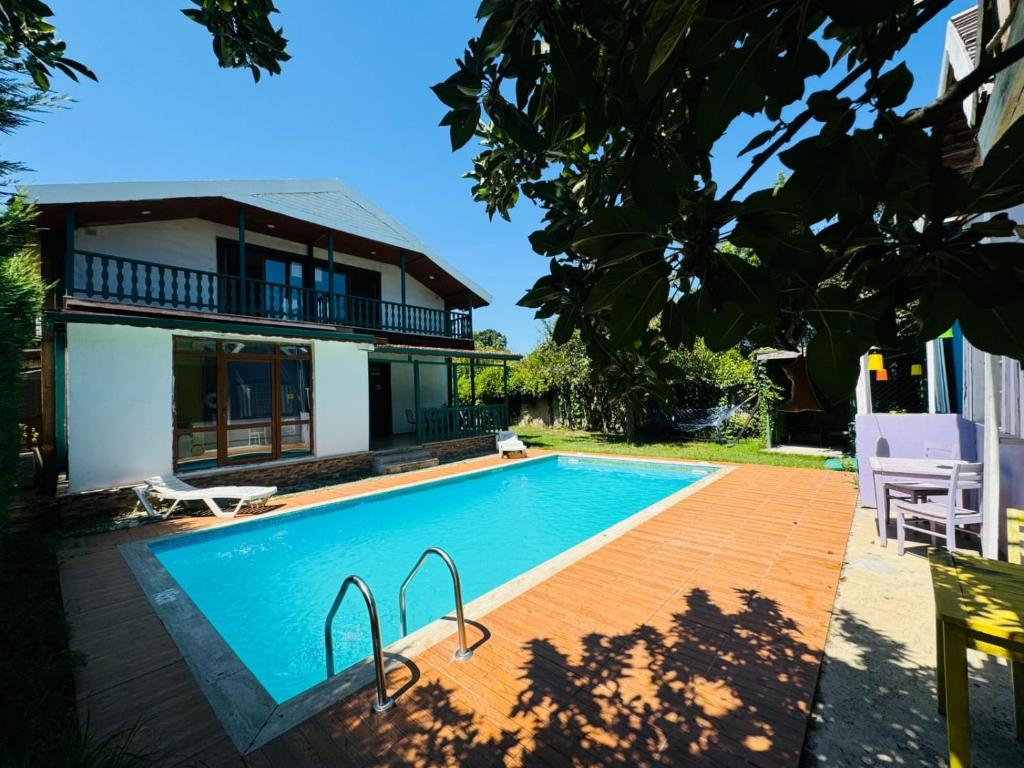 a swimming pool in front of a house at Sapanca Bizim Konak in Sapanca