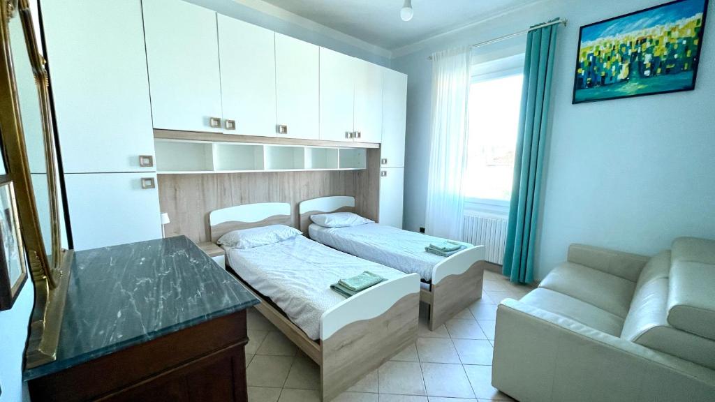 a small room with a bed and a couch at Cuore di Firenze in Florence