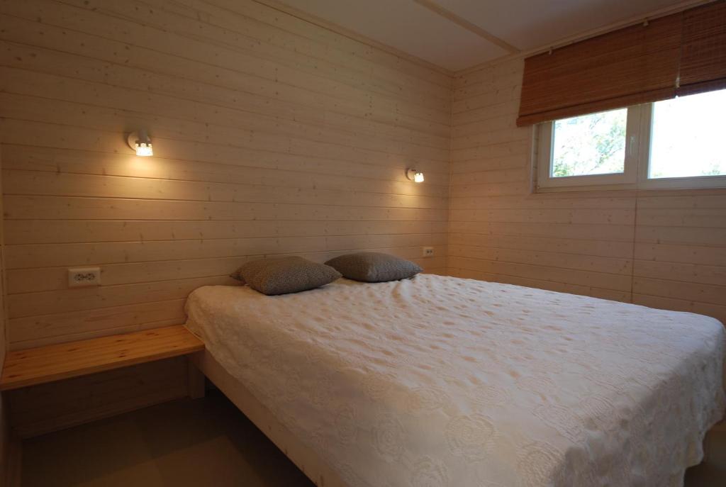 Postel nebo postele na pokoji v ubytování Mandjala Puhketalu - Cottages