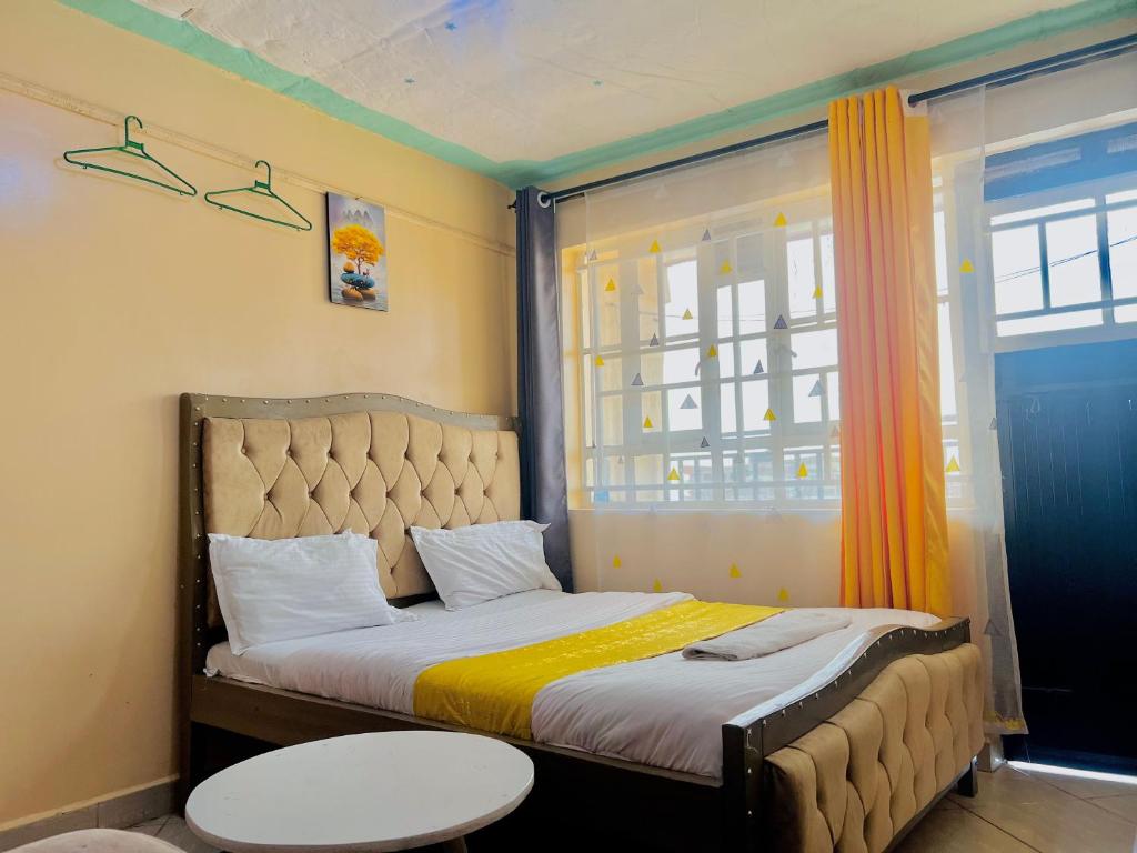 Ένα ή περισσότερα κρεβάτια σε δωμάτιο στο White Arts homes