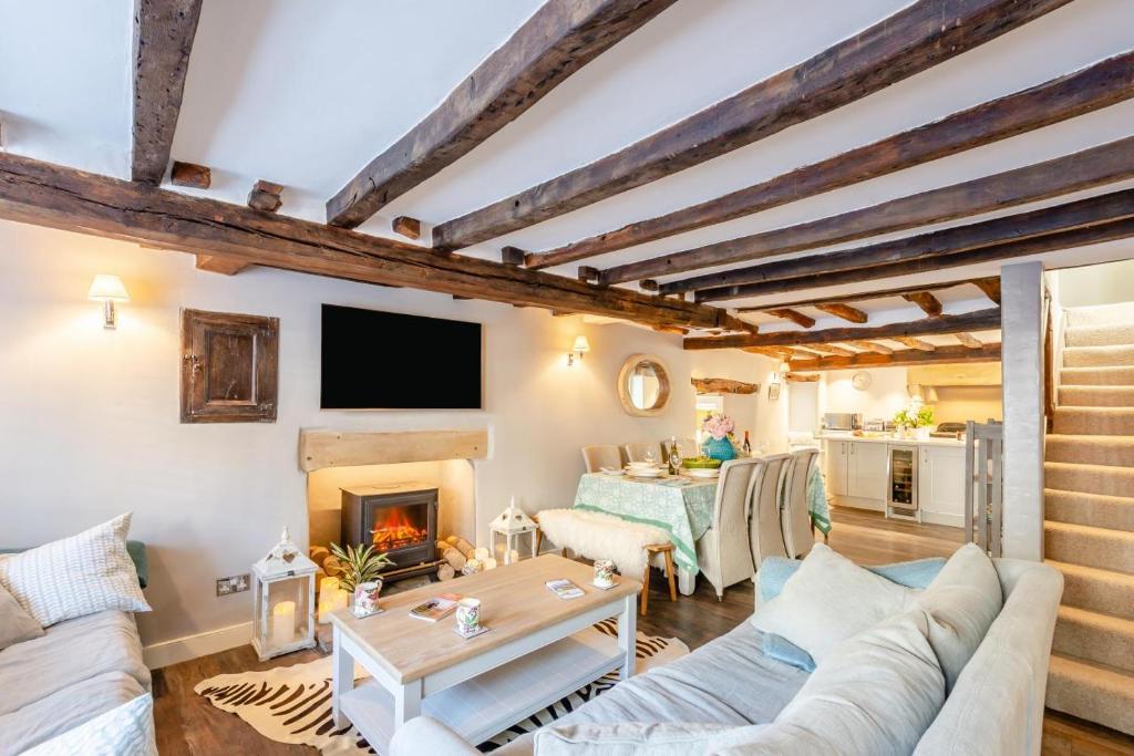 a living room with a couch and a fireplace at 4 Bed in Cartmel oc-d31802 in Cartmel