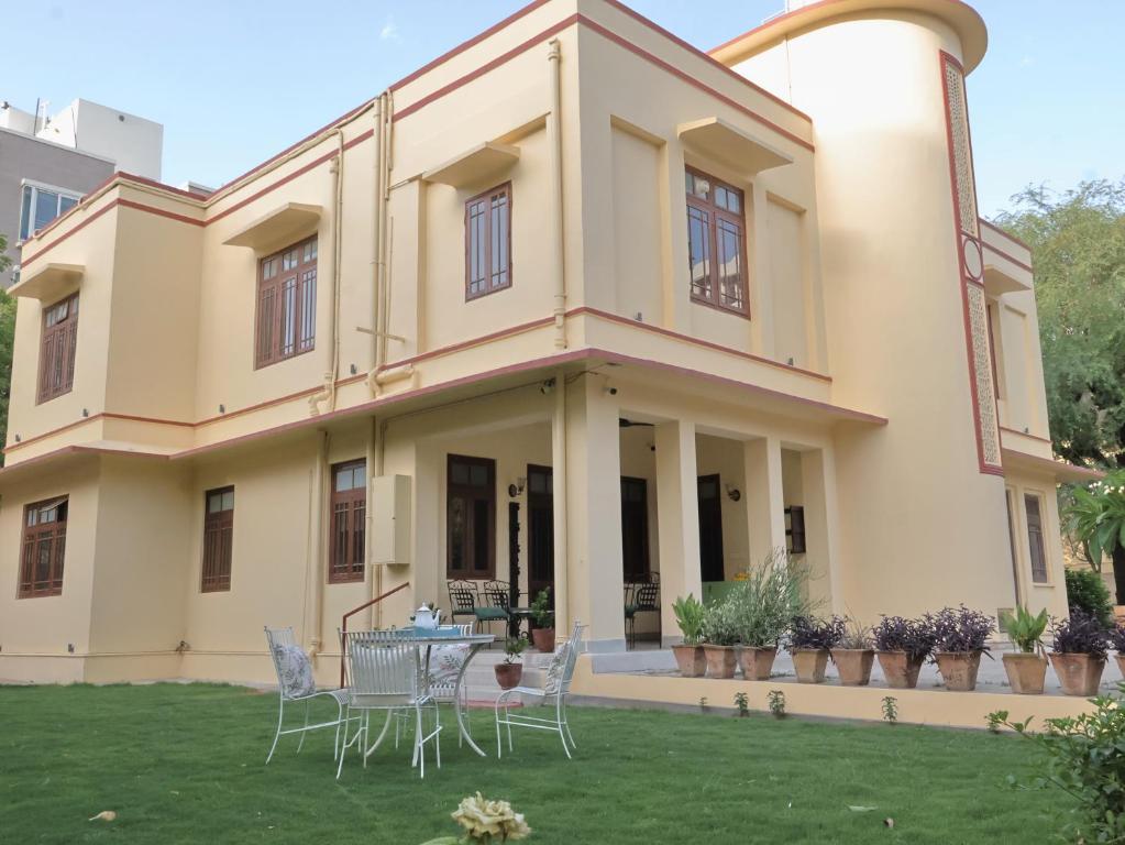 a house with a lawn in front of it at Mundoota House in Jaipur