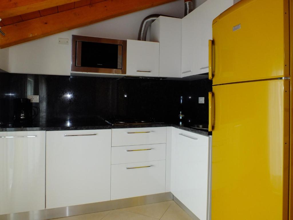 Kuchyň nebo kuchyňský kout v ubytování Villaggio Hemingway - Family Aparthotel