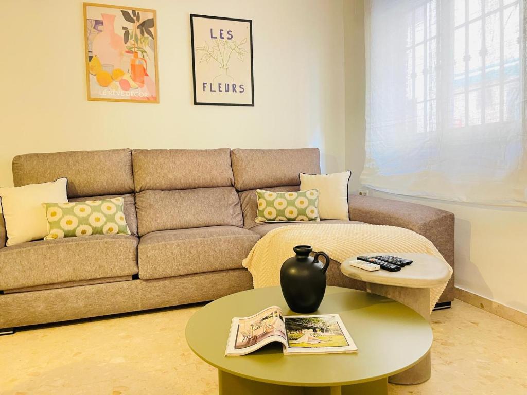 a living room with a couch and a table at Comeback Sweet Summer Day in Torrenueva