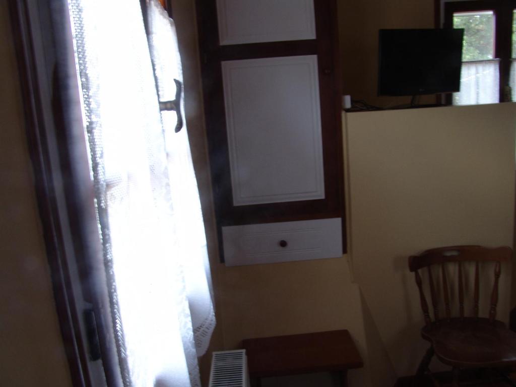 TV a/nebo společenská místnost v ubytování Aiolos Rooms
