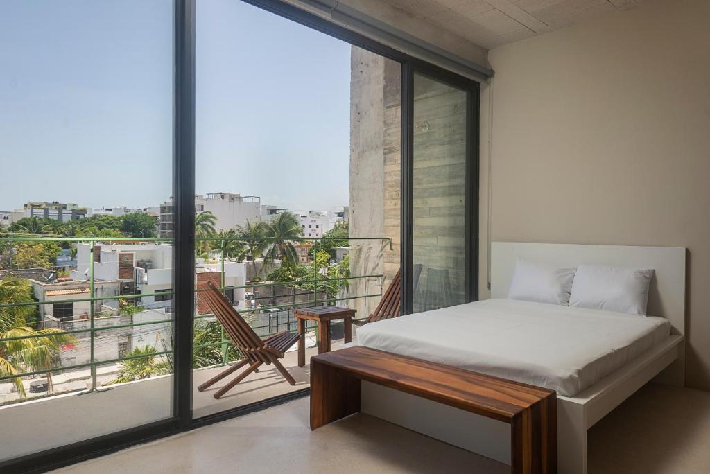 En eller flere senge i et værelse på MK Playa del Carmen