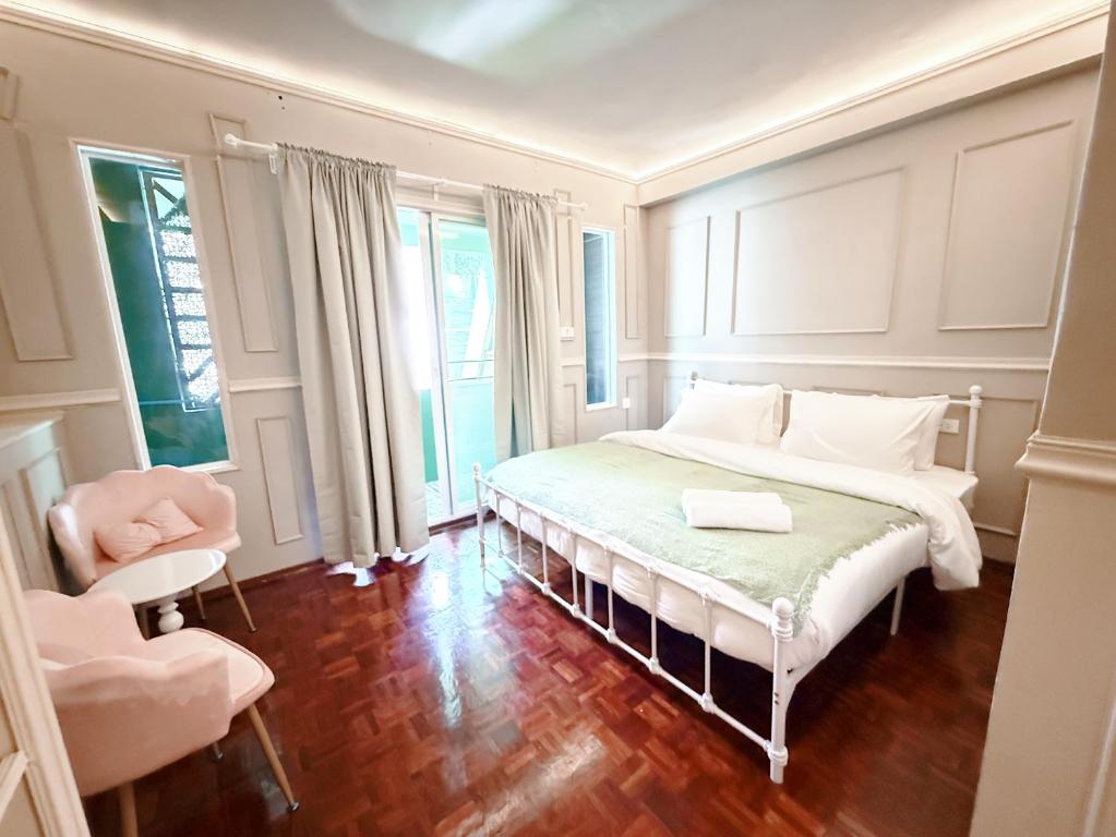 Ένα ή περισσότερα κρεβάτια σε δωμάτιο στο CASA Sukhumvit 11 - คาซ่า สุขุมวิท 11