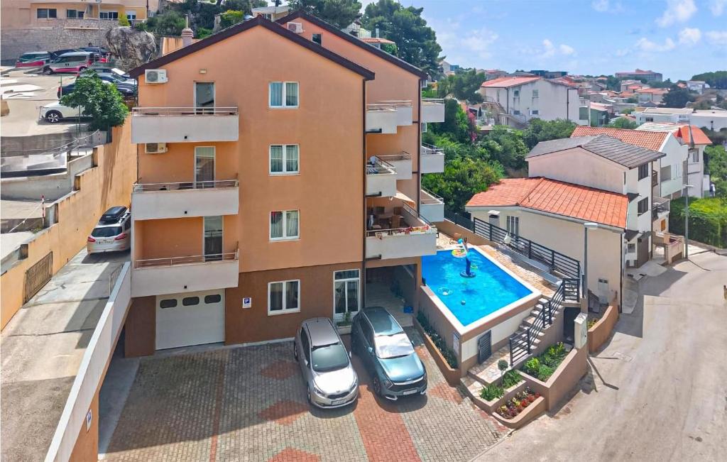 an aerial view of a apartment building with a swimming pool at 1 Bedroom Nice Apartment In Baska Voda in Baška Voda