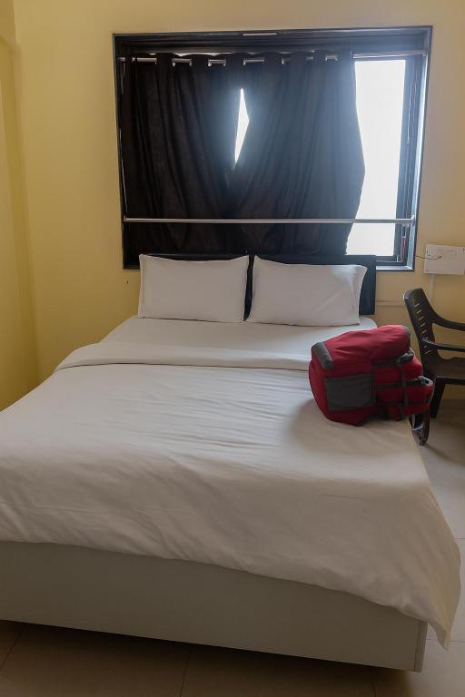 Una cama o camas en una habitación de Hotel Shiya Palace