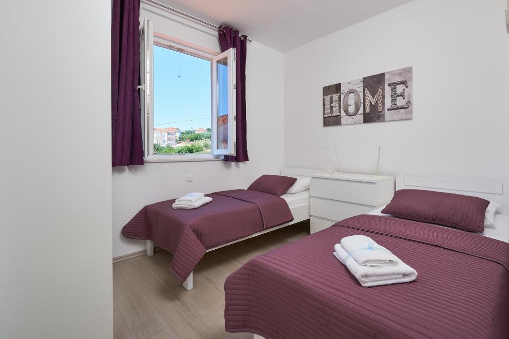 Posteľ alebo postele v izbe v ubytovaní Villa Mila Trogir