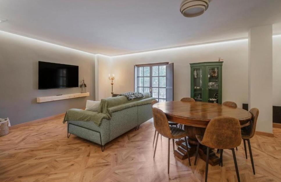 a living room with a couch and a table at Centro Burgos Real Consulado 1787 in Burgos