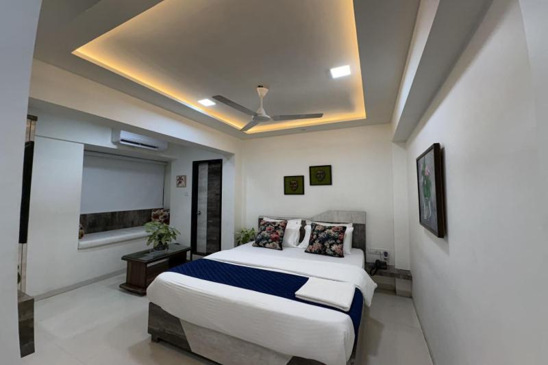 a bedroom with a large bed in a room at Hotel Park Inn in Mumbai