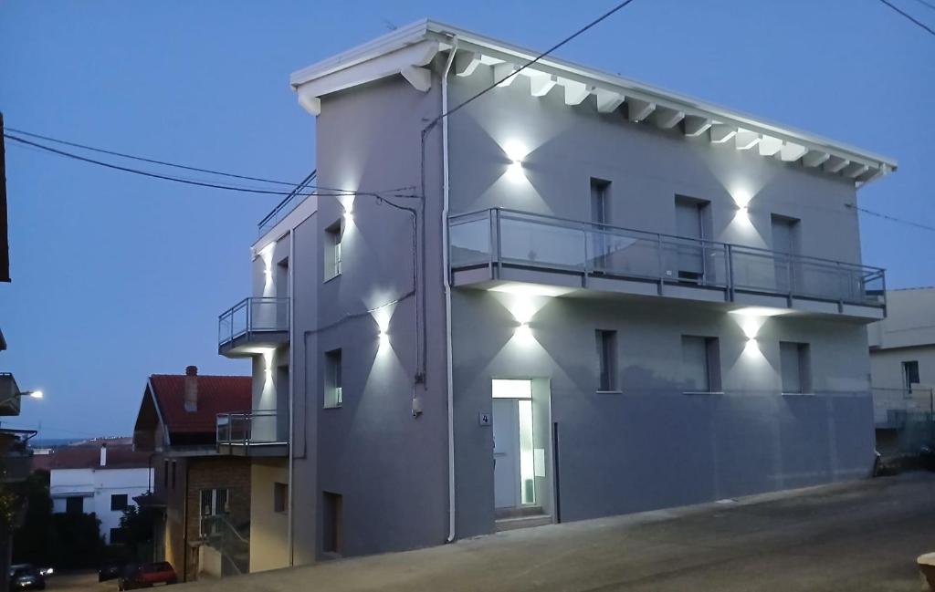 a white building with lights on the side of it at LaVenere da Gigi e Patty in San Salvo