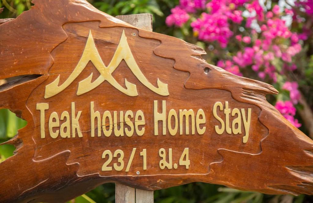a sign that says leak house home stay at Teak House Homestay I in Ban Thung Satong