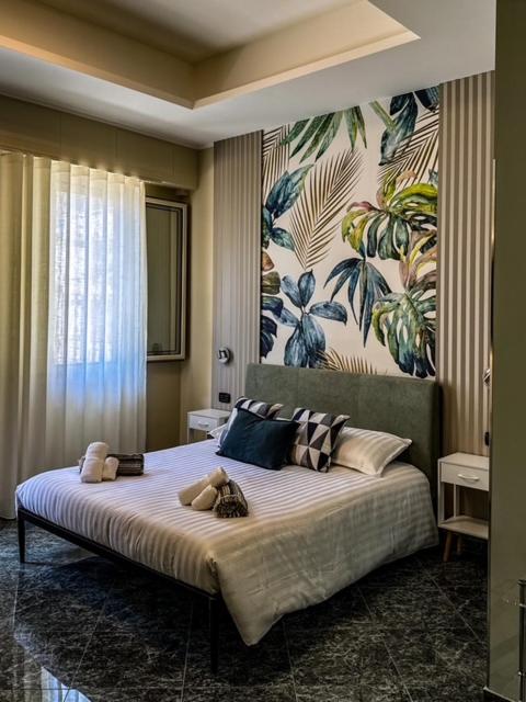 a bedroom with a large bed with teddy bears on it at Burgi's House in Pizzo