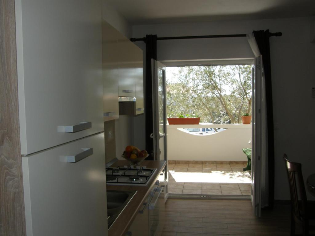 Kuchyň nebo kuchyňský kout v ubytování Apartments Marino