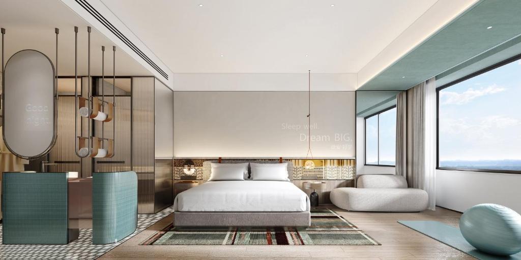 Postel nebo postele na pokoji v ubytování EVEN Hotel Yining