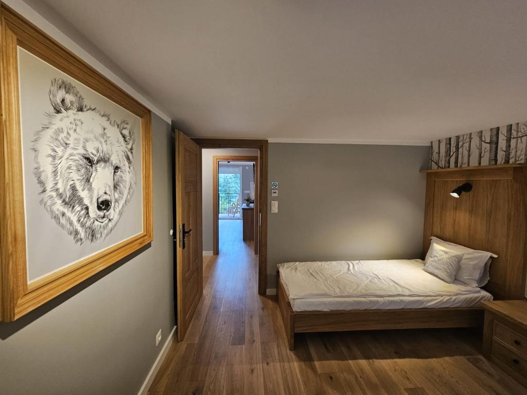Giường trong phòng chung tại Apartamenty Zdrojowa 6