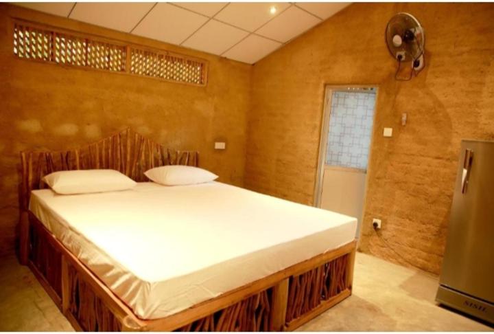 a bedroom with a large bed in a room at Breezy Haven Ella in Ella