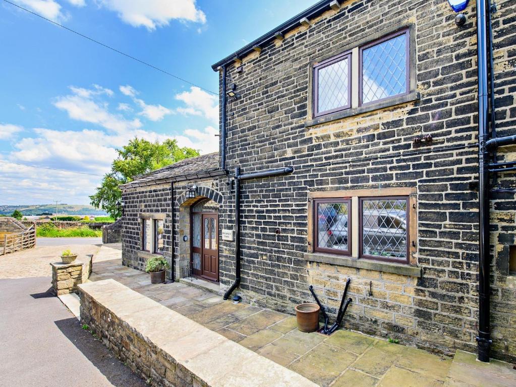 an exterior view of a brick house at 5 Bed in Halifax 96061 in Sowerby Bridge