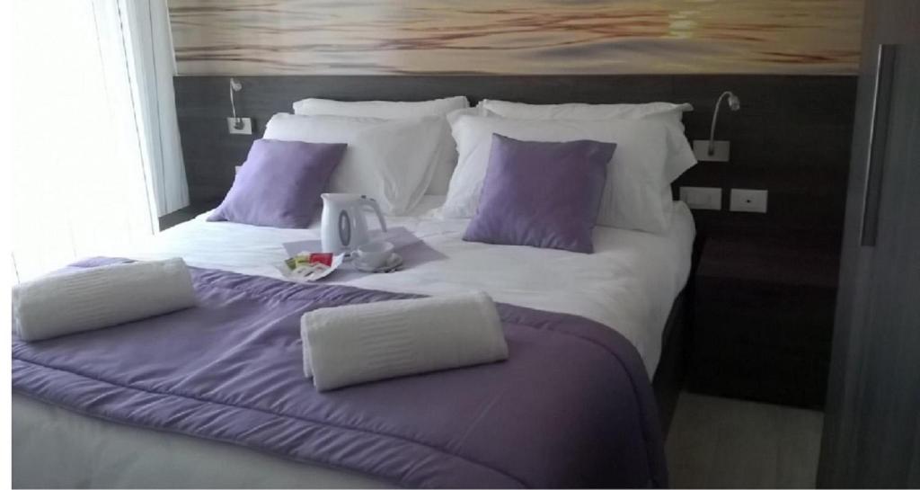Postel nebo postele na pokoji v ubytování Hotel Tre Rose