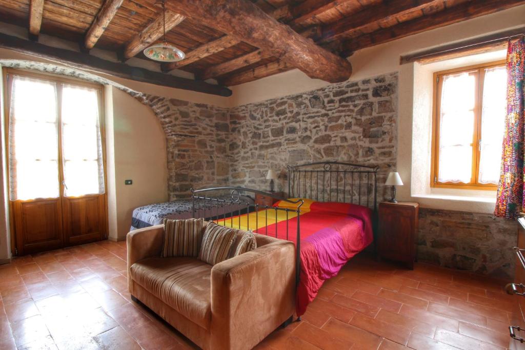 Łóżko lub łóżka w pokoju w obiekcie Country House Cozzena