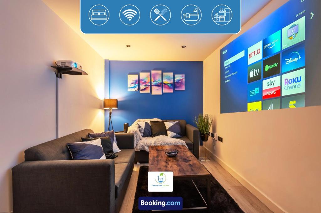 a living room with a couch and a table at Spacious 1 Bedroom Apartment By Green Haven Escapes Short Lets & Serviced Accommodation Bradford With 4K Cinema Experience in Bradford