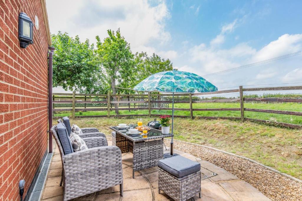 a patio with a table and chairs and a fence at 1 Bed in Flore oc-b32437 in Flore