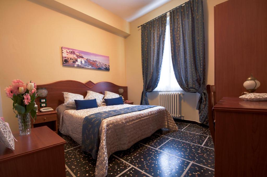 Postel nebo postele na pokoji v ubytování Hotel Bristol
