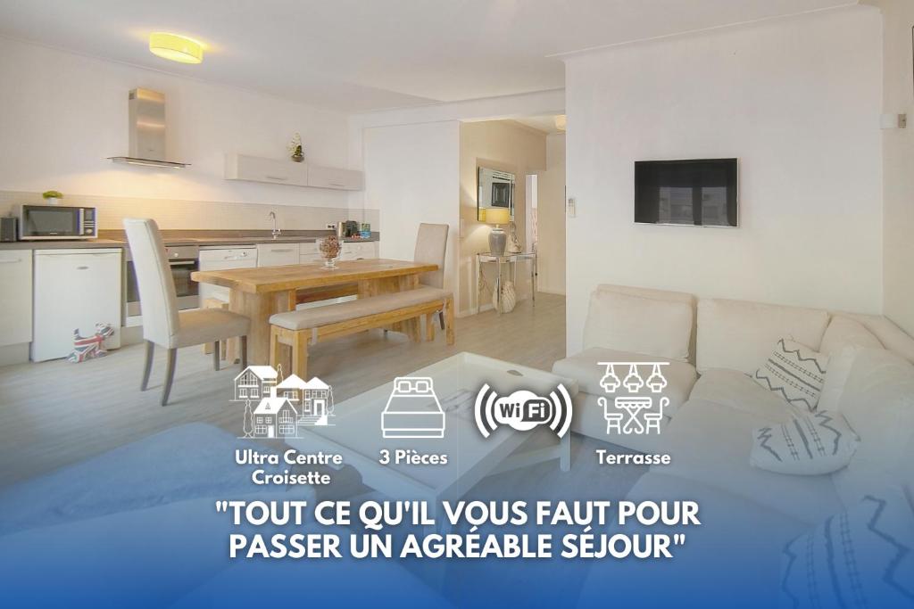 Il dispose d'une cuisine et d'un salon avec une table et un canapé. dans l'établissement Moli - 3Pièces - 4Min Mer - Luxe - VCA, à Cannes