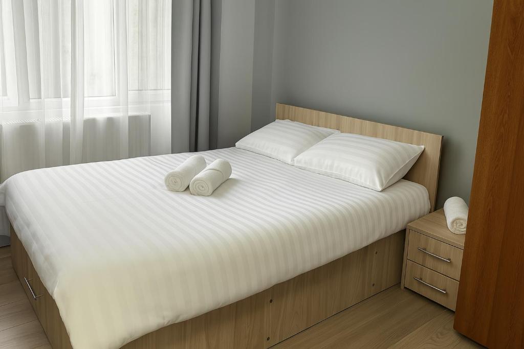 Postel nebo postele na pokoji v ubytování Astra Urban Leaf