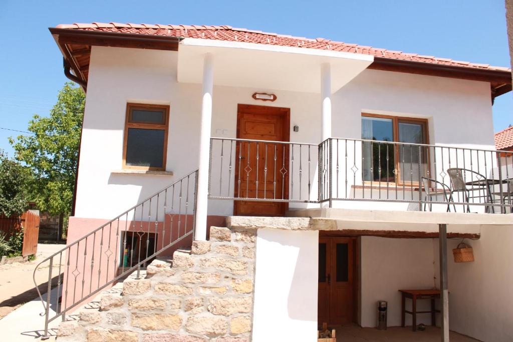 a villa with a staircase to the second floor at Ижата 2 in Borovitsa