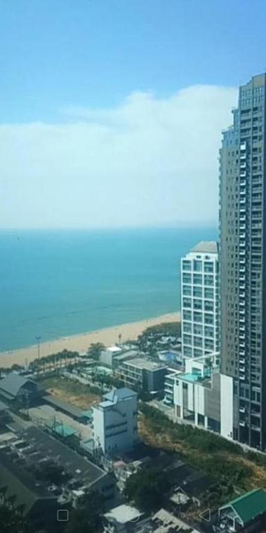 an aerial view of a city with a beach and buildings at 1 Bedroom Seaview Jomtein Pattaya 33sqm floor9th 90 3 in Jomtien Beach