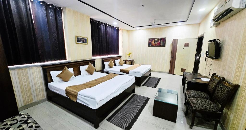 Postel nebo postele na pokoji v ubytování Hotel HK Continental
