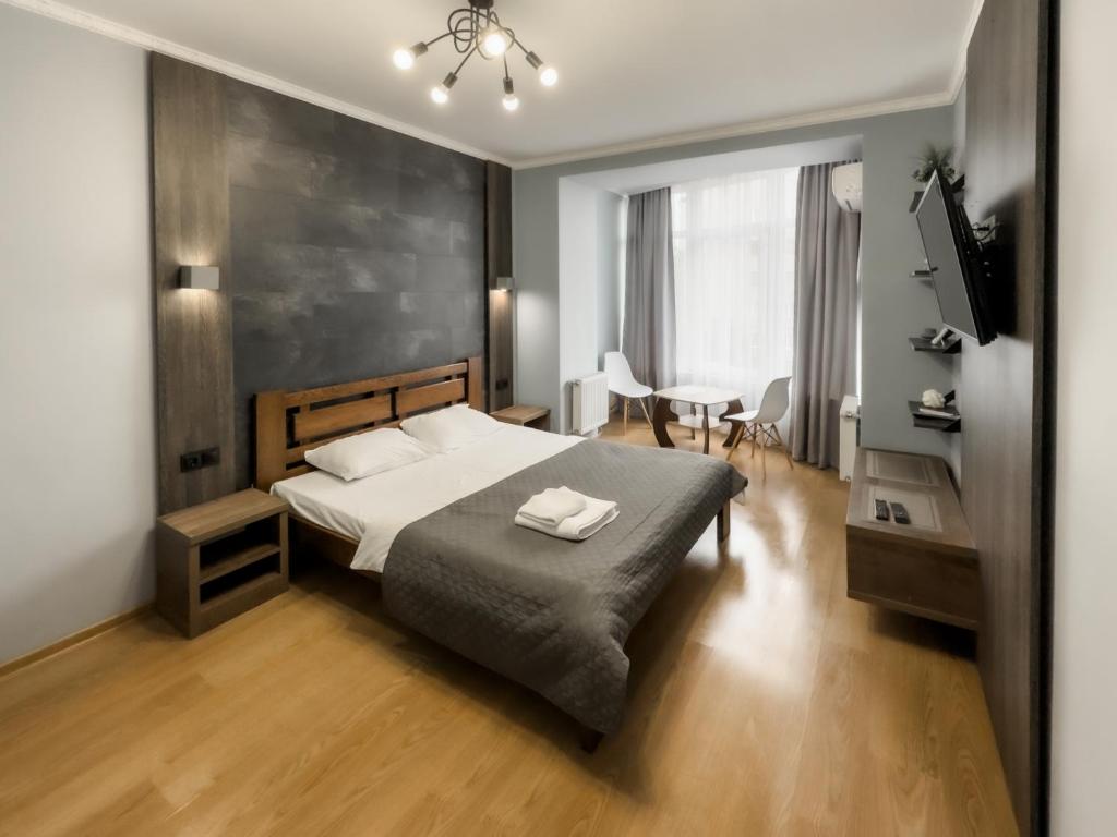 Postel nebo postele na pokoji v ubytování Lux.Ap4you.if