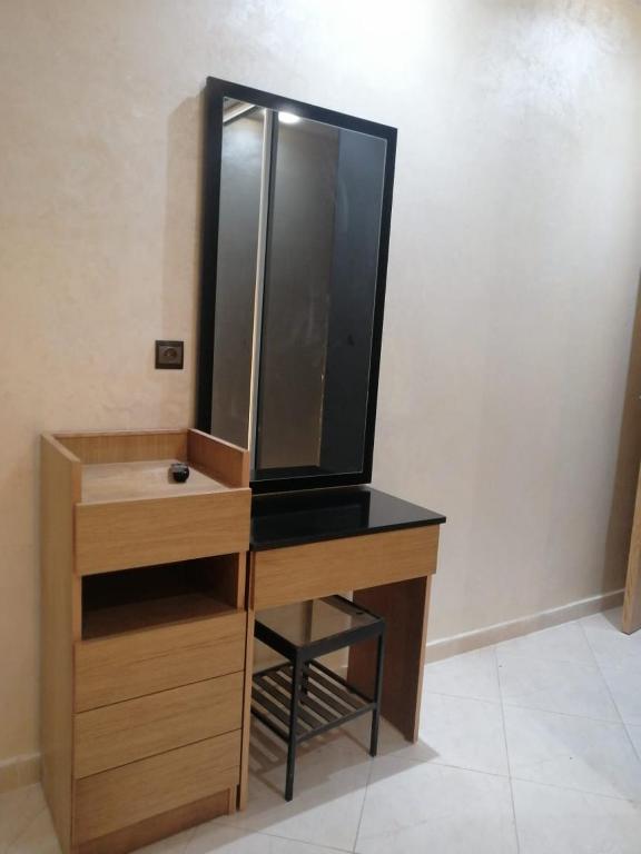 a dressing table with a mirror on top of it at ميرمار in Tétouan