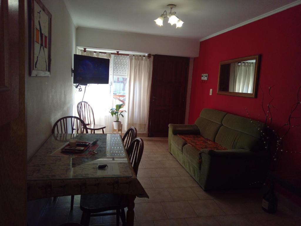 a living room with a couch and a table at Departamento Arana in Tandil