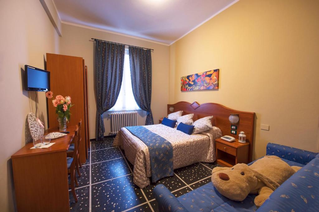 Postel nebo postele na pokoji v ubytování Hotel Bristol