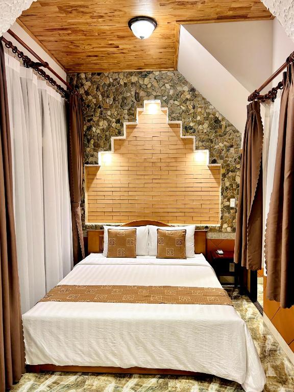 Giường trong phòng chung tại Sầm Sơn Boutique Hotel Phan Thiết