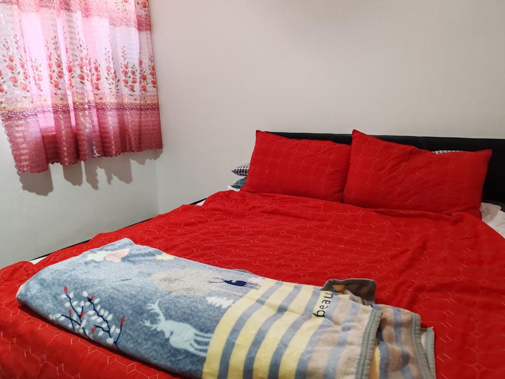 Ένα ή περισσότερα κρεβάτια σε δωμάτιο στο Ayan Homestay