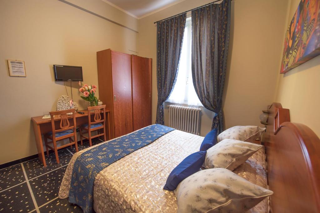 Postel nebo postele na pokoji v ubytování Hotel Bristol