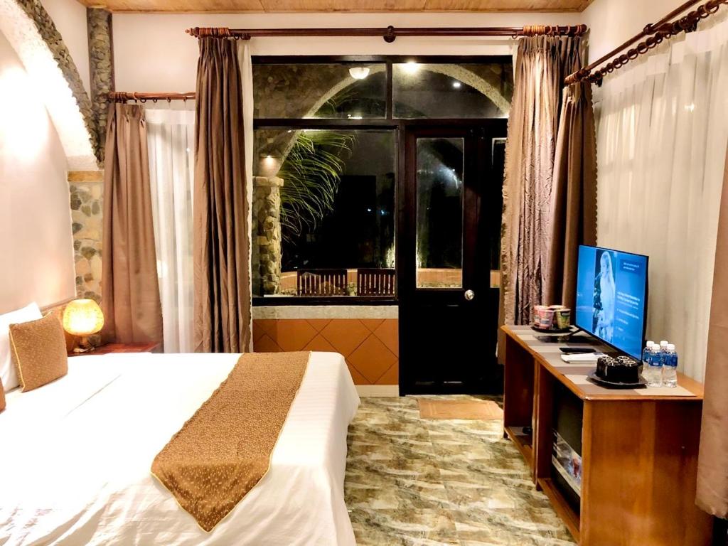Giường trong phòng chung tại Sầm Sơn Boutique Hotel Phan Thiết