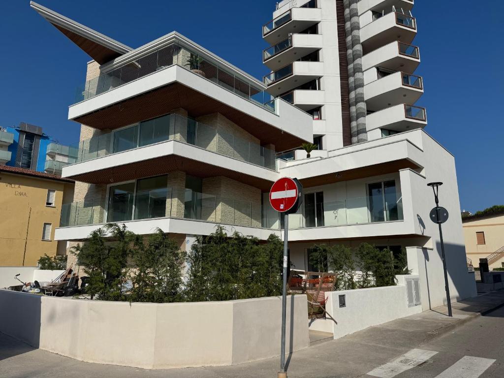 a tall building on a street with a do not enter sign at Residenza Harmonia in Lignano Sabbiadoro