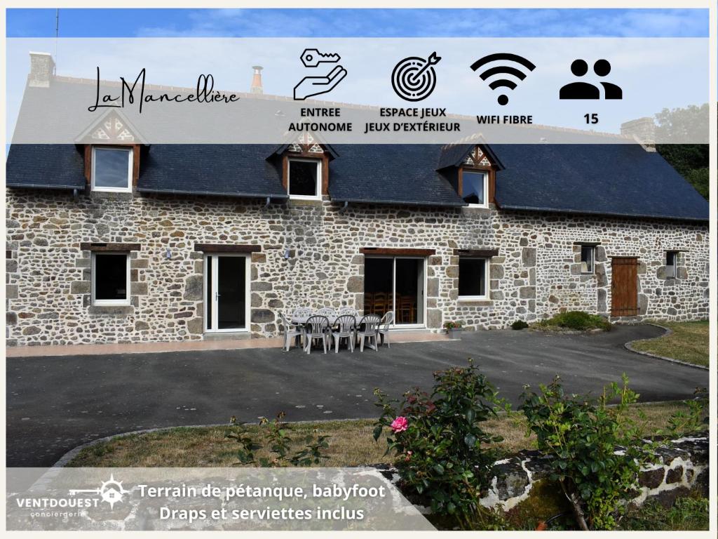 a stone building with a sign on top of it at Gîte La Mancellière - Maison familiale 12pers, grand jardin, jeux & pétanque - Pleine nature 