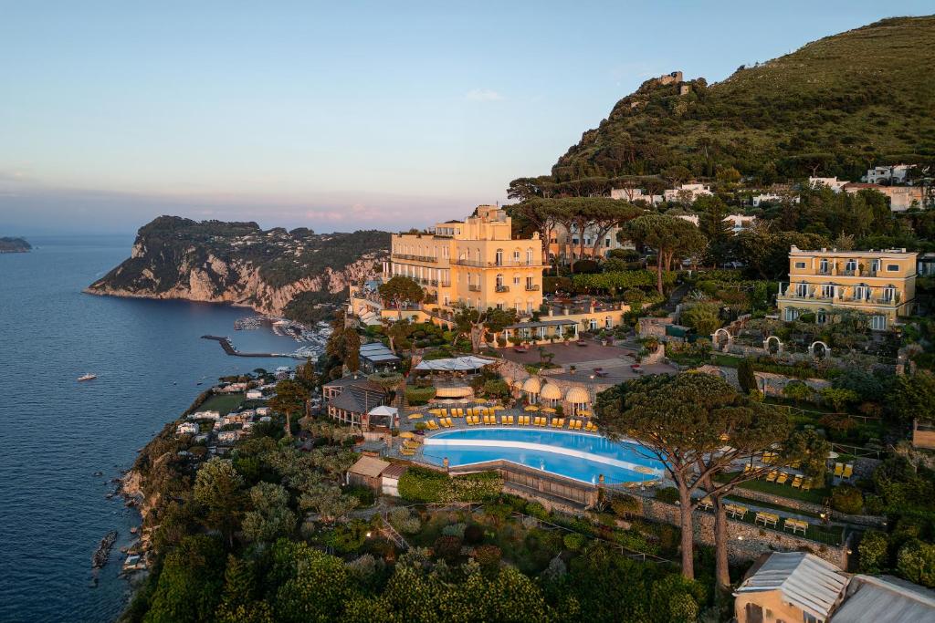 an aerial view of a resort on a hill next to the water at Hotel Caesar Augustus in Anacapri
