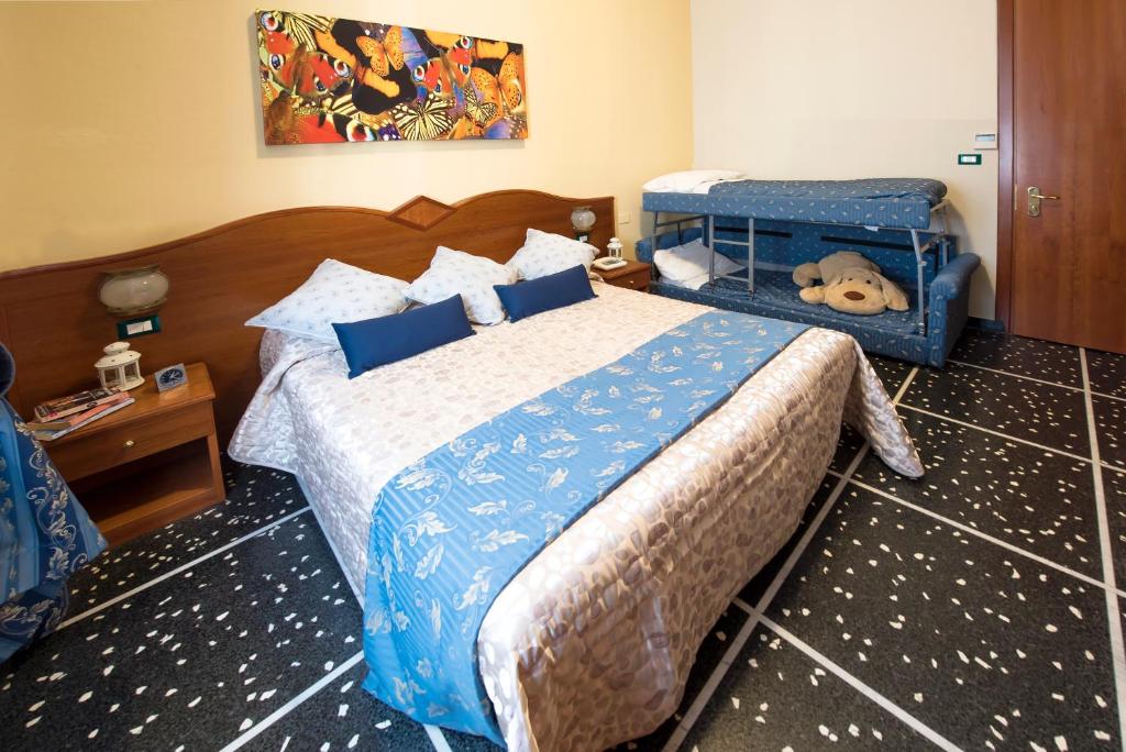 Postel nebo postele na pokoji v ubytování Hotel Bristol