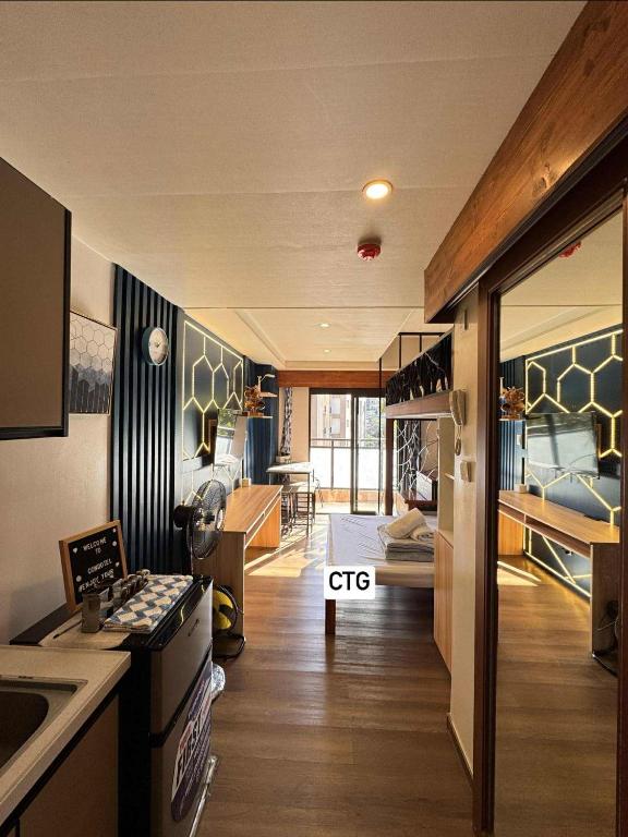 a room with a kitchen and a living room at the 5th floor in Baguio