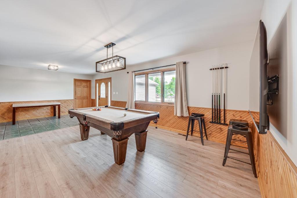 a living room with a pool table and a tv at Lake Mary View Pickleball Paradise Penthouse Unit in Twin Lakes